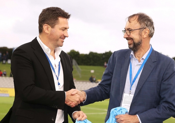 UNSW DVCA Merlin Crossley (right) and Sydney FC Chairman Scott Barlow (left) shake hands at the first Sky Blues doubleheader of 2021. Photo: Sydney FC