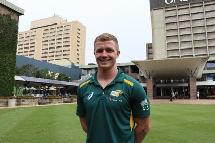 Henry Hutchison in an Australian 7s polo on the UNSW Library Lawn